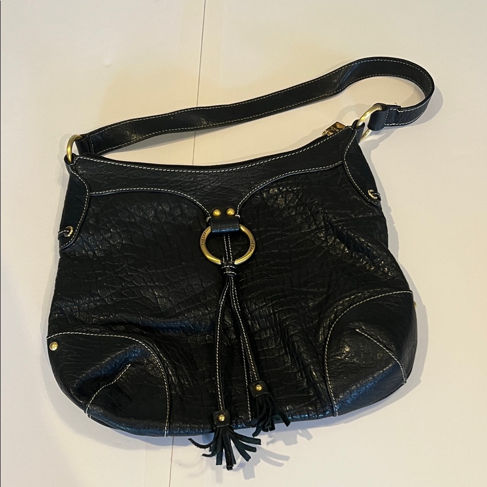 The Sak Black Leather Shoulder Bag with Gold Ring and Tassel